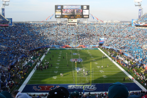 SuperBowl event, wide view of the stadium, with people on the pitch and fans filling the seats. Prediction markets FanDuel and DraftKings may offer Super Bowl parlays, as CME issues its own certification