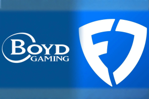 Boyd Gaming reports higher 2025 revenue boosted by FanDuel sale profit. Blue graphic showing the Boyd Gaming logo on the left and a stylized white FanDuel shield logo on the right against a blue gradient background.