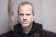 Booking photo of Christopher Armacost shown in a recent arrests graphic listing a charge of engaging in organized criminal activity, felony. Hitchcock Mayor arrested after sweeping gambling investigation targets City Hall operations