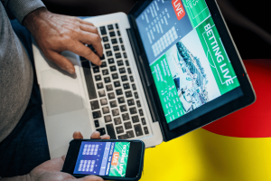 Online sports betting on laptop and mobile phone representing Germany gambling market. Germany study finds most online gambling now on licensed sites