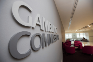 Gambling Commission headquarters sign inside office building after High Court National Lottery licence ruling involving Allwyn and Camelot UK
