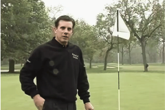 Matt Gogel stands beside the flagstick on a golf course during a golf event. Matt Gogel suspended six months after betting on PGA Tour competitions