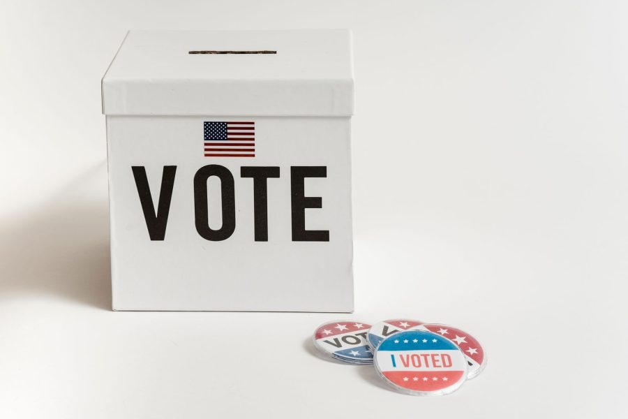 A ballot being placed in a box