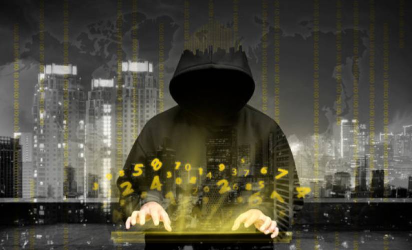 Computer hacker silhouette of hooded man